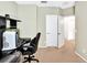 Home office featuring a comfortable desk, rolling chair, and neutral paint at 707 N Marotta Loop, Ocoee, FL 34761