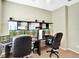 Bright office space equipped with two desks, multiple monitors, and office chairs at 707 N Marotta Loop, Ocoee, FL 34761