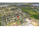 Wide aerial view of home in a neighborhood close to a lake and green space at 724 Duff Dr, Winter Garden, FL 34787