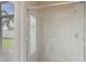 Modern shower with sliding glass doors and a window for natural light creates a bright and airy atmosphere at 724 Duff Dr, Winter Garden, FL 34787