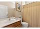 Well-lit bathroom features a vanity, toilet, and shower with neutral colors and traditional fixtures at 724 Duff Dr, Winter Garden, FL 34787