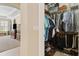 Organized walk-in closet with shelving and hanging storage, keeping clothes and accessories neatly arranged at 724 Duff Dr, Winter Garden, FL 34787