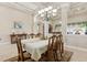 Charming dining area with an elegant chandelier and classic furnishings at 724 Duff Dr, Winter Garden, FL 34787