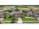 Aerial view of a beautiful home with manicured lawn and landscaping, showcasing its prime location in a vibrant community at 724 Duff Dr, Winter Garden, FL 34787
