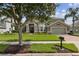 Two-story home featuring stone accents, an attached two-car garage, and a well-maintained front yard at 724 Duff Dr, Winter Garden, FL 34787