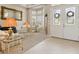 Inviting foyer with double doors, tiled flooring, and a view into a comfortable living room at 724 Duff Dr, Winter Garden, FL 34787