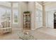 Bright foyer with tiled flooring, double doors, and a glimpse of a cozy sitting area at 724 Duff Dr, Winter Garden, FL 34787