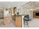 Open-concept kitchen featuring a breakfast bar, granite countertops, and seamless flow to the living area at 724 Duff Dr, Winter Garden, FL 34787