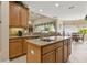 Open kitchen with granite counters, custom cabinetry and access to dining and living areas at 724 Duff Dr, Winter Garden, FL 34787