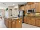 Bright kitchen featuring stainless appliances, custom cabinets, and a functional island for meal prep at 724 Duff Dr, Winter Garden, FL 34787