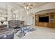 Spacious living area with a ceiling fan, comfortable seating and media center at 724 Duff Dr, Winter Garden, FL 34787