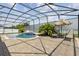 Backyard pool with spa, surrounded by brick pavers, within a screened enclosure, and outdoor seating at 724 Duff Dr, Winter Garden, FL 34787
