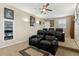 Home theater featuring tiered seating with leather recliners and large flat screen television at 724 Duff Dr, Winter Garden, FL 34787