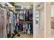 Spacious walk-in closet with ample hanging and storage space for organizing clothing and accessories at 724 Duff Dr, Winter Garden, FL 34787