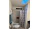 This bathroom features a decorative shower curtain, and a skylight for natural light at 816 Polo Park East Blvd, Davenport, FL 33897