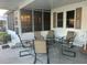 Relaxing covered patio with comfortable seating and a view of the surroundings at 816 Polo Park East Blvd, Davenport, FL 33897