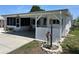 Charming single-story home with covered parking, updated exterior, and manicured landscaping at 816 Polo Park East Blvd, Davenport, FL 33897
