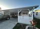Single-story home with covered parking, privacy lattice, and manicured landscaping at 816 Polo Park East Blvd, Davenport, FL 33897