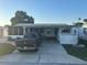 Charming single-story home with covered parking and decorative landscaping at 816 Polo Park East Blvd, Davenport, FL 33897