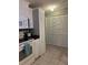 Kitchen features modern appliances, white cabinets and multiple storage closets at 816 Polo Park East Blvd, Davenport, FL 33897