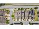 Aerial view of a beautiful neighborhood showing homes with solar panels and manicured lawns at 8160 Iron Mountain Trl, Windermere, FL 34786