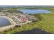 Overhead aerial view of a the homes and their proximity to a beautiful lake at 8160 Iron Mountain Trl, Windermere, FL 34786