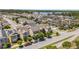 A beautiful aerial view of the neighborhood showing multiple homes and a pond at 8160 Iron Mountain Trl, Windermere, FL 34786