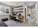 A bedroom with a large window providing natural light, desk, and futon at 8160 Iron Mountain Trl, Windermere, FL 34786