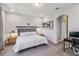 A serene bedroom with a plush bed, ambient lighting, and an archway leading to the en-suite bathroom at 8160 Iron Mountain Trl, Windermere, FL 34786