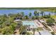 A gorgeous community pool with a large lake in the background at 8160 Iron Mountain Trl, Windermere, FL 34786