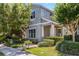 Charming two-story home with well-manicured landscaping and a welcoming front porch at 8160 Iron Mountain Trl, Windermere, FL 34786