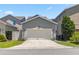 Two car garage with driveway on a well maintained property at 8160 Iron Mountain Trl, Windermere, FL 34786