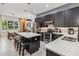 Bright kitchen features a center island, stainless appliances, and open access to dining area at 8160 Iron Mountain Trl, Windermere, FL 34786