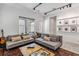 Inviting living room with dual sofas, track lighting, and a view to the outdoor area at 8160 Iron Mountain Trl, Windermere, FL 34786