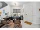 Modern living room offers ample seating, natural light, and contemporary design at 8160 Iron Mountain Trl, Windermere, FL 34786