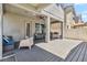 Outdoor patio with a fan, plenty of seating, grill, and an outdoor kitchen area for entertaining guests at 8160 Iron Mountain Trl, Windermere, FL 34786