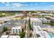 Aerial view of the property with landscaping, a pool, and a downtown skyline in the background at 860 N Orange Ave # 323, Orlando, FL 32801