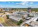 Aerial view of condo buildings, parking garages, and a skyline with green foliage at 860 N Orange Ave # 323, Orlando, FL 32801