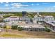 Birds eye view of multi-story condo buildings with parking garage and city skyline in distance at 860 N Orange Ave # 323, Orlando, FL 32801