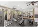 Community fitness center with weightlifting machines, weights, mirrors, and ceiling fans at 860 N Orange Ave # 323, Orlando, FL 32801