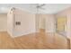 Bright living room with hardwood floors and sliding glass doors to a balcony at 860 N Orange Ave # 323, Orlando, FL 32801