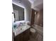 This bathroom features a vanity with granite countertop, tiled shower, and bathtub at 9831 Barley Club Dr # 8, Orlando, FL 32837