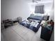 Bedroom with tile flooring, a ceiling fan, and natural light from windows at 9831 Barley Club Dr # 8, Orlando, FL 32837