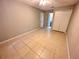 Large, neutral bedroom featuring ample closet space and connecting bathroom access at 9831 Barley Club Dr # 8, Orlando, FL 32837