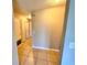 Hallway with tile floors and multiple storage closets for maximum convenience at 9831 Barley Club Dr # 8, Orlando, FL 32837
