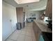 This kitchen flows into the living area and features a granite countertop and stainless steel appliances at 9831 Barley Club Dr # 8, Orlando, FL 32837