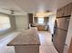 Kitchen with granite countertops, stainless steel appliances, breakfast bar, and tiled floors at 9831 Barley Club Dr # 8, Orlando, FL 32837