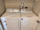Washer and dryer hookups in a dedicated laundry space for added convenience at 9831 Barley Club Dr # 8, Orlando, FL 32837