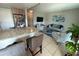 Comfortable living room with large windows and a view to kitchen and dining area at 9831 Barley Club Dr # 8, Orlando, FL 32837