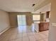 Open-concept living room with connecting kitchen, neutral walls and lots of light at 9831 Barley Club Dr # 8, Orlando, FL 32837